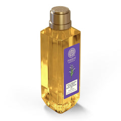 Forest Essentials body massage oil bottle with gold finish and purple label panel