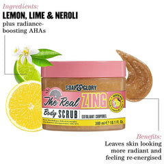 Body scrub jar with pink lid, Real Zing body scrub label and citrus ingredient callouts