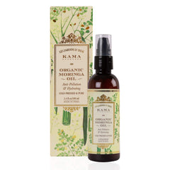 Organic moringa oil bottle with pump next to matching leaf-pattern carton box