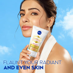 NIVEA Luminous Even Glow face wash tube in hand with white cap and front label