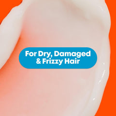Orange conditioner gel close-up with creamy, smooth swirled texture