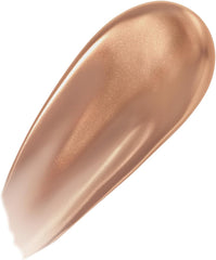 Shimmering nude-gold lip glaze swatch with glossy shine