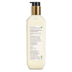 Forest Essentials body milk bottle with gold pump; back label with directions and SPF25