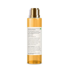Body massage oil bottle rear view with label text; amber glass, gold pump