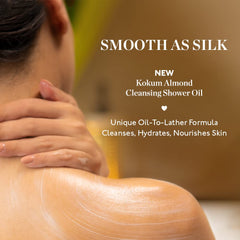 Cleansing shower oil spread on skin by hand, smooth creamy texture