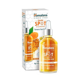 Turmeric face serum bottle with matching product box, dark spot clearing formula.