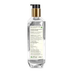 Baby hair and body wash bottle, transparent with gold pump, back label shown