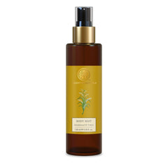 Forest Essentials body mist bottle with gold cap, amber glass and yellow label