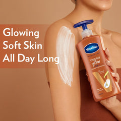 Vaseline Cocoa Glow body lotion bottle with blue pump held on arm with lotion smear