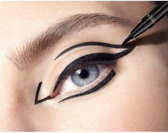 Black winged eyeliner on open eye with eyeliner applicator