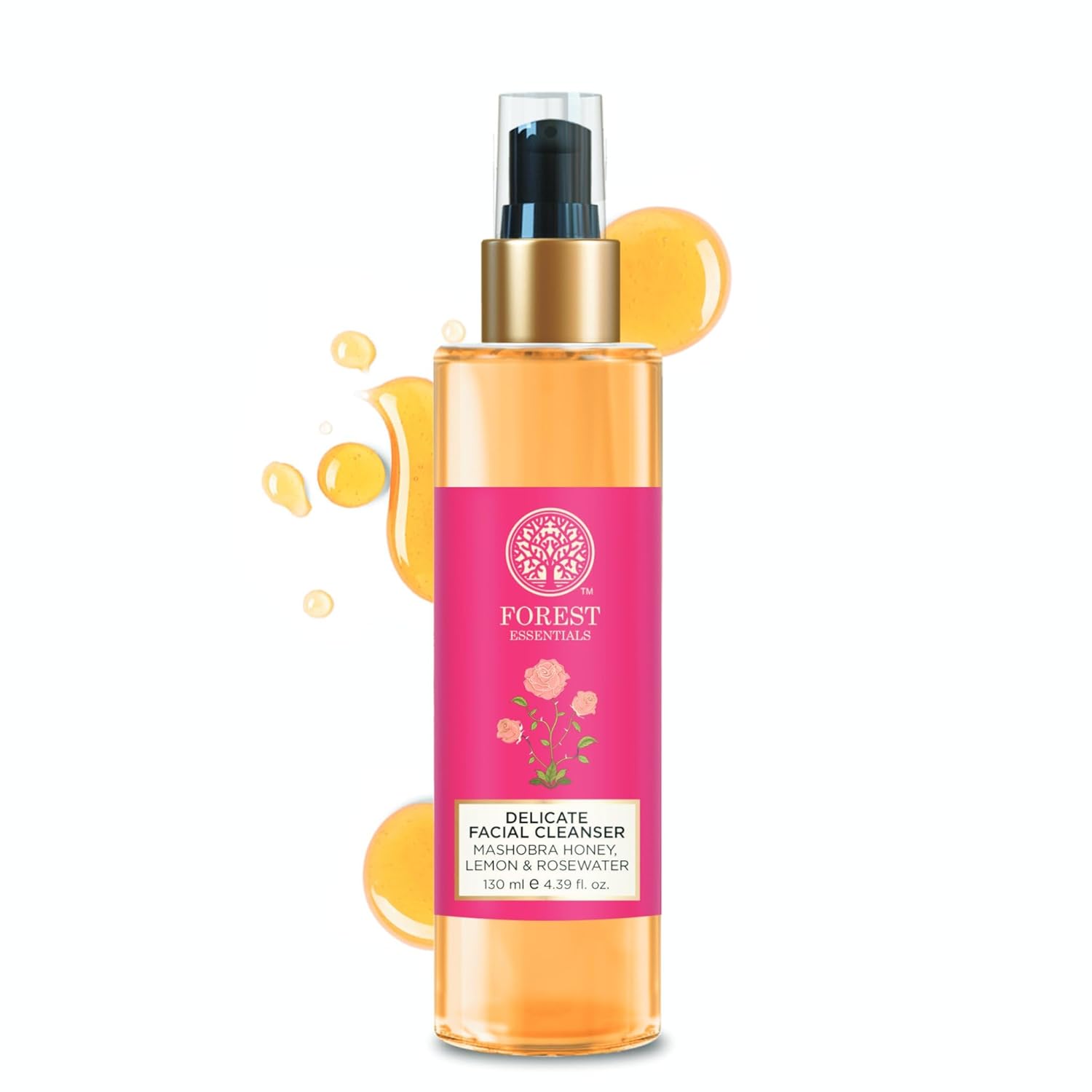 Amber facial cleanser bottle with gold pump and pink label