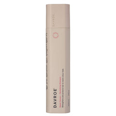 Davroe revitalizing shampoo bottle, beige plastic cylinder with red logo and side text