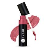 Glossy transferproof lipstick in pink-brandy shade, open tube with swatch