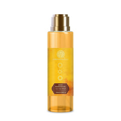 Body massage oil bottle with gold pump; amber liquid, 130 ml