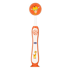 Orange toothbrush with giraffe head cap, suction-cup base, and white bristle head