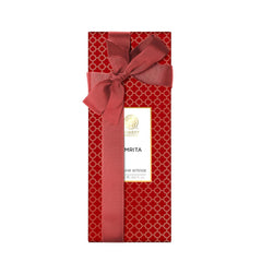 Red ribbon perfume gift box with Forest Essentials Amrita label