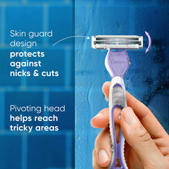 Bikini razor with pivoting head and skin guard, held in a hand