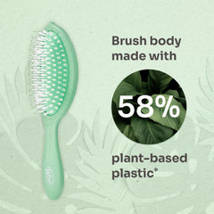 Mint green paddle hair brush with oval bristle pad and handle