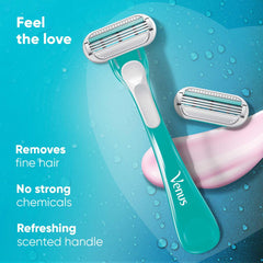 Women's razor with blue handle and white cartridge head, water droplets visible