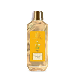 Forest Essentials silkening shower wash bottle, clear amber with gold cap and yellow label