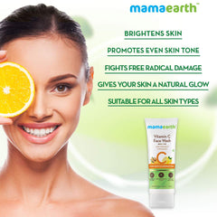 mamaearth Vitamin C Face Wash small white tube beside a woman holding an orange slice