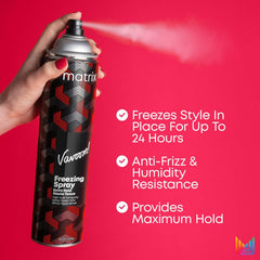 Hair freezing spray aerosol can held in hand, black cap, red/black label