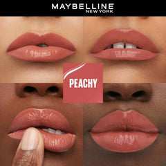 Peachy glossy lipstick on lips, showing shiny, smooth finish.