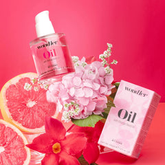 Wondher Oil 50 ml bottle with orange seed oil package; clear bottle and pink pump cap