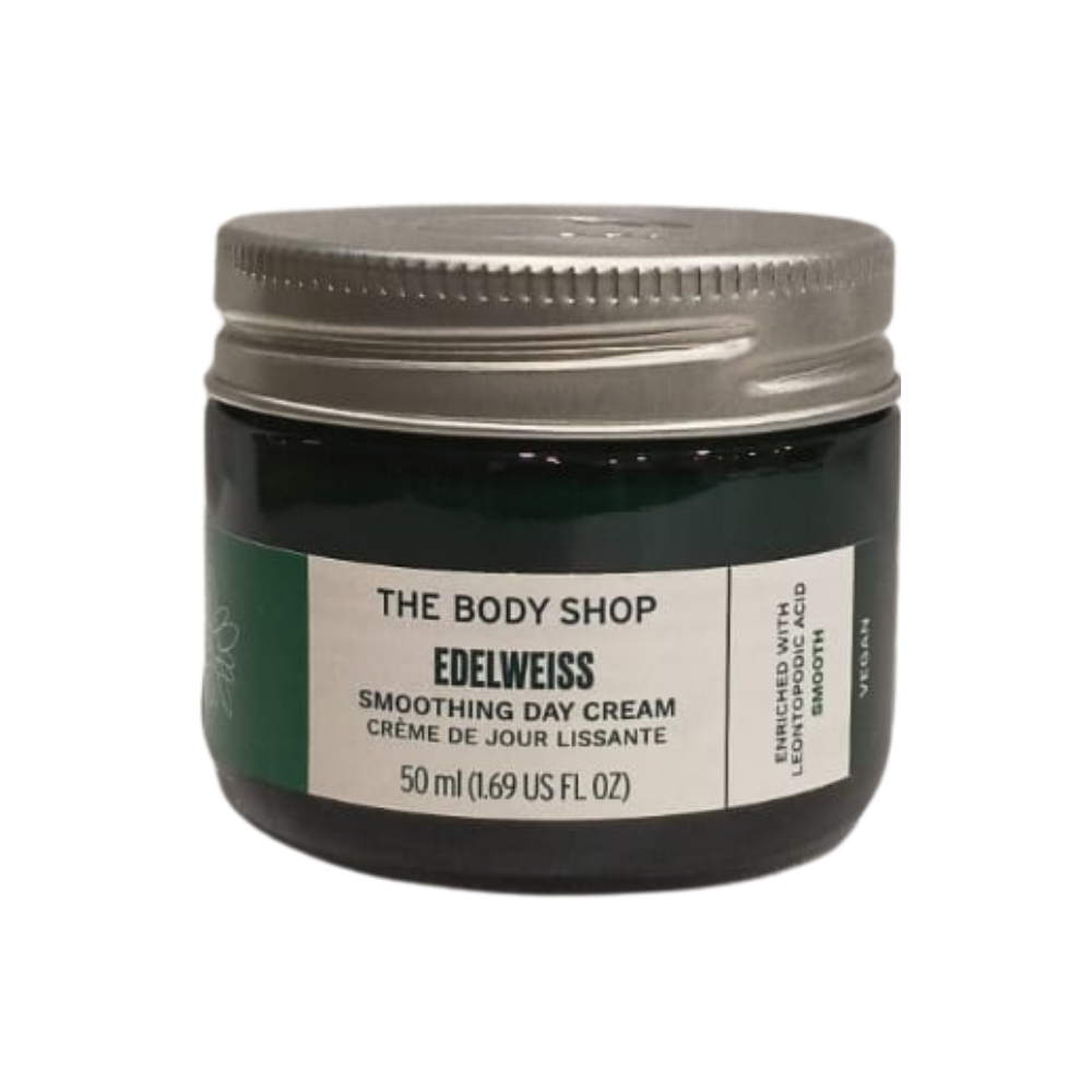 The Body Shop Edelweiss smoothing day cream jar, dark green glass with white label