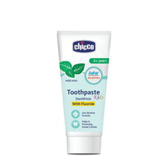 Kids toothpaste tube with white body, blue Chicco label, and green mint leaves.