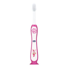 Pink kids toothbrush with white bristles and bunny-decorated handle