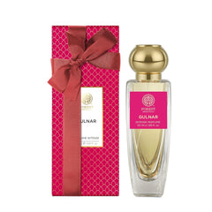 Forest Essentials Gulnar intense perfume bottle beside pink gift box with bow