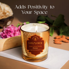 SoulFlower glass votive candle Rang in amber speckled glass with burning wick