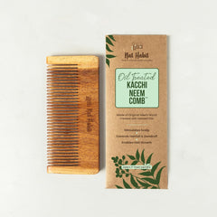 Small oil-treated neem wood comb with fine teeth, shown with retail box