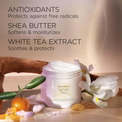 White Tea body cream jar with white lid among flowers and natural ingredients