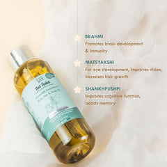 Summer Dasabuti baby hair and scalp oil bottle with “Brahmi” and “Matsyakshi” info.