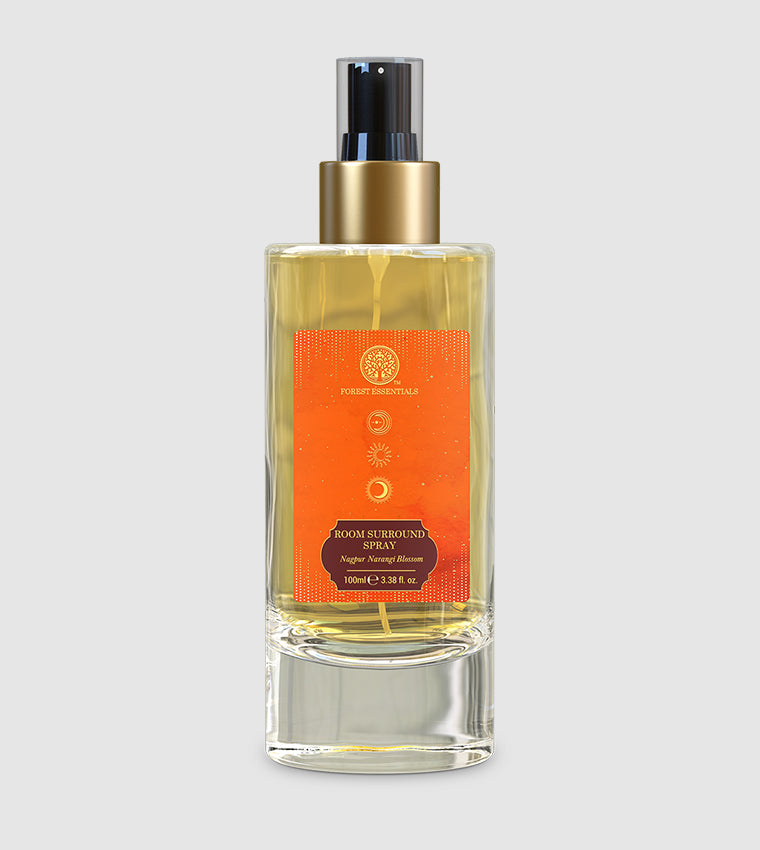Room spray bottle with gold pump and orange label, clear glass with 100 ml size
