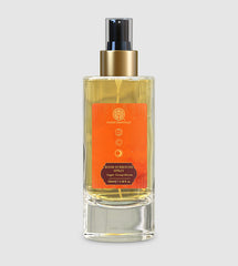 Room spray bottle with gold pump and orange label, clear glass with 100 ml size