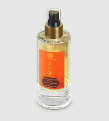 Room surround spray bottle with gold trigger sprayer, clear glass and orange front label