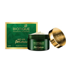 Youth eye cream set with green jar, gold lid, cream on lid, and box