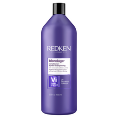 Purple Redken Blondage conditioner bottle with black cap, front label visible
