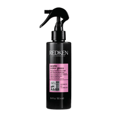 Redken acidic color gloss heat protection leave-in bottle with pink label and spray pump