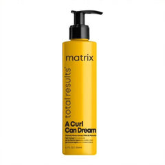 Hair styling gel bottle with black pump, yellow Matrix total results label