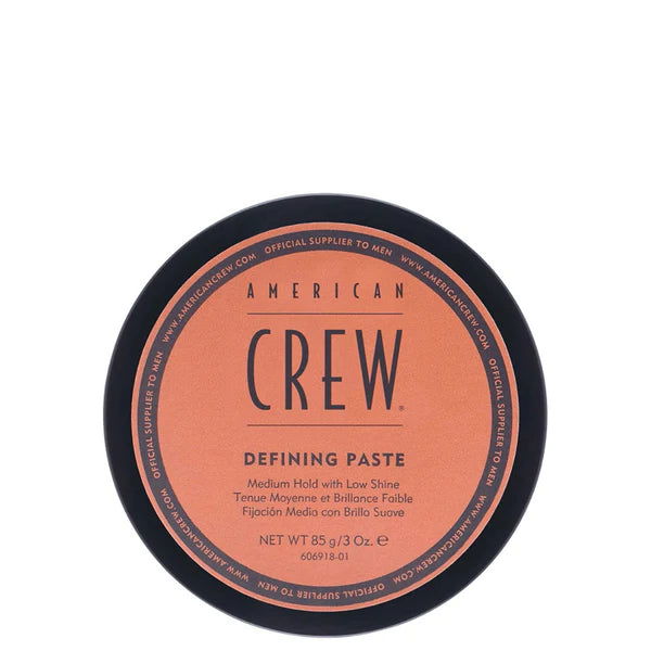 American Crew Defining Paste jar lid, black rim and peach label, medium hold hair paste.