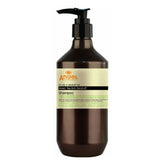 Brown shampoo bottle with black pump, label for anti-dandruff green tea