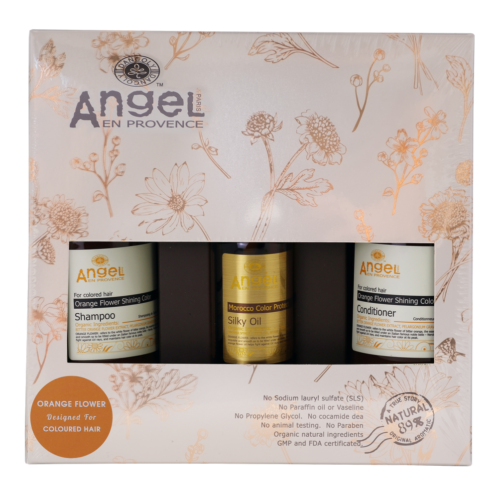 Hair care gift set box with orange flower shampoo, conditioner, and silky oil