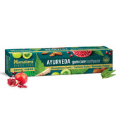 Ayurveda gum care toothpaste box, green teal with fruit and herb illustrations