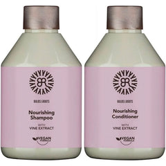 Nourishing shampoo and conditioner bottles with vine extract, pink labels, beige caps.
