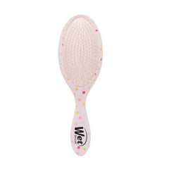 Pink oval detangling hairbrush with perforated cushion pad and curved handle