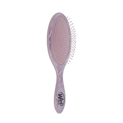 Purple hair detangling brush with flexible bristles, side view